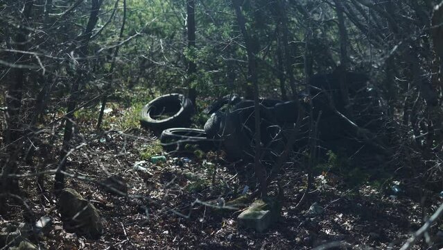 Pile of garbage on green grass in the nature environment problems. Nature protection. Environment pollution concept