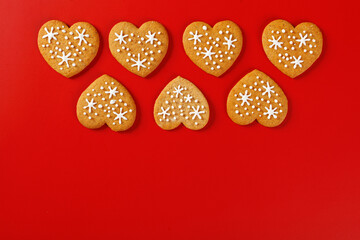 beautiful hand-baked cookies in the shape of a heart on a red background