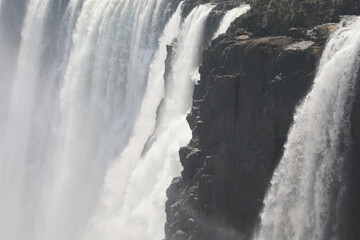 Fototapeta na wymiar Water flowing over the crest of Victoria Falls