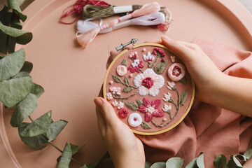 hand-embroidered flowers in an embroidery frame