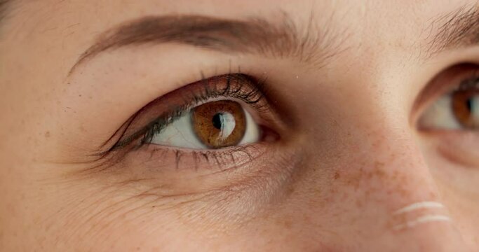 Eyes, thinking and future with person closeup in studio for hope, optimism or contemplation. Eye health, vision and planning with model looking away for natural cosmetics, optometry or satisfaction