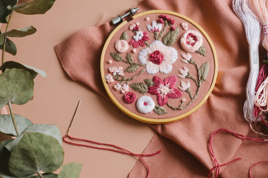 hand-embroidered flowers in an embroidery frame