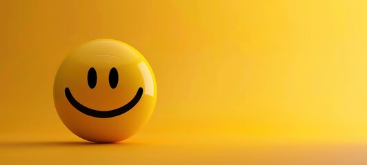 Fototapeta premium Yellow smiley face emoticon on yellow background banner