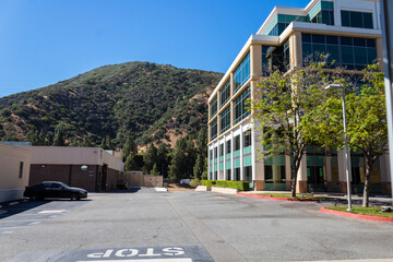 Burbank, California, USA, June 20, 2022: Warner Bros. Office Building with Mont Lee in the background.