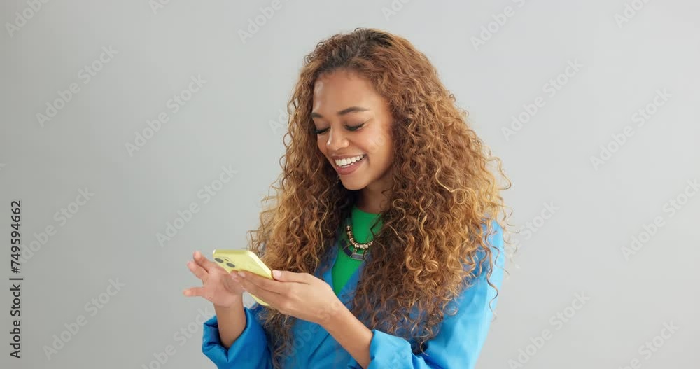 Poster happy woman, typing and networking with phone for social media or communication on a gray studio bac