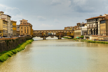 Naklejka premium Florence, Tuscany. Ponte Vecchio (Holy Trinity) medieval stone bridge over the Arno river. Italy