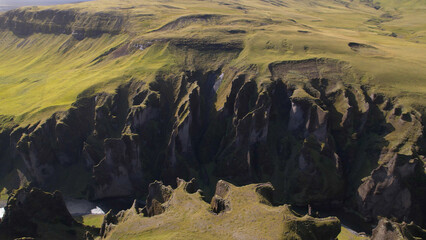 Fjadrargljufur (or Fjadra Canyon) is a 100 m deep and about 2 kilometres long serpentine canyon with the Fja&eth;r&aacute; river flowing through it, South Iceland.
