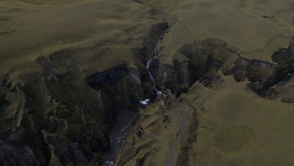 Fjadrargljufur (or Fjadra Canyon) is a 100 m deep and about 2 kilometres long serpentine canyon with the Fjaðrá river flowing through it, South Iceland.