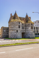 Fototapeta na wymiar Porte de Tourelles was built in XV century from sandstone and flint and was rebuilt several times. Les Tourelles is the last of the seven gates in wall surrounding Dieppe. Dieppe, Normandy, France.
