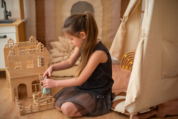 rainbow in the interior children's room in a Scandinavian interior. girl playing