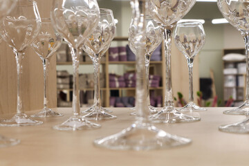Glass wine glasses in the interior of the room, close-up