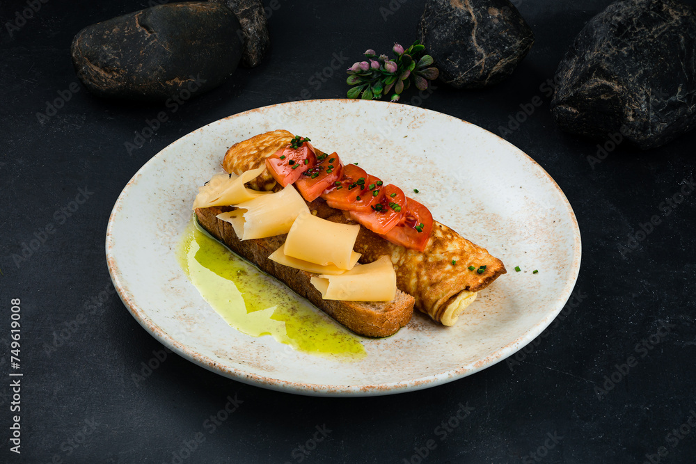 Wall mural breakfast fried omelette with tomatoes, cheese and bread.