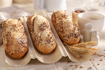 Crispy wholegrain baguettes baked in a bright rustic kitchen.