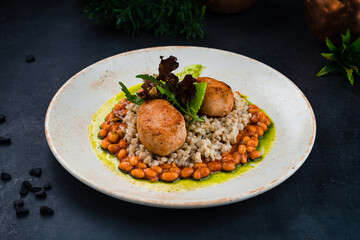 Lunch chicken cutlet with barley porridge, beans and greens.