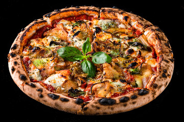 Italian dinner pizza with eggplant, cheese, tomatoes, basil, tomato sauce and spices isolated on black.