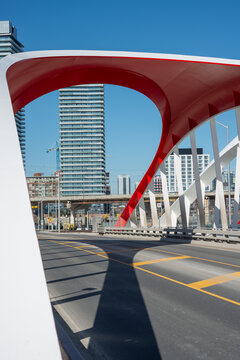 look back at the city through Cherry Street North Bridge designed by Entuitive, schlaich bergermann partner (sbp), and Grimshaw Architects, Port Lands, on the Toronto waterfront east 