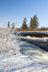 Flowing river in a winter wonderland 