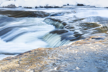 Water flowing past the trail at Pine Point Rapids in Manitoba 