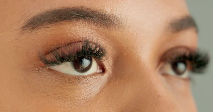 Eyes, thinking and vision with person closeup in studio for hope, optimism or contemplation. Health, future and planning with model looking away for natural cosmetics, optometry or satisfaction