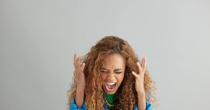 Woman, anger and shouting with depression in studio for stress, mental health or death by background. Girl, person or model with anxiety, frustrated and screaming with pulling hair in panic attack