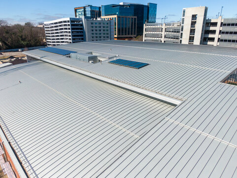 Professional Aerial Drone Image of a Large Standing Seam Metal Roof on a Commercial Building in Downtown Raleigh, North Carolina: Architecture, Roofing, Engineering, Industry