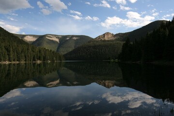 Fototapeta premium Reflection of mountains on Crystal Lake Montana