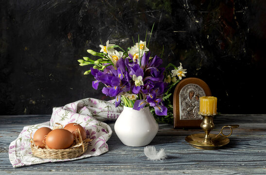 A bouquet with narcissus and irises, nest and eggs in vintage style