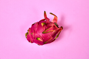 Red dragon fruit Set with appetizing serving on pink background. Top view