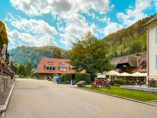 Summer Vacation Village Scene in the Mountainous Forest. A beautiful Summer day in an idyllic...
