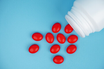 Closeup of red tablets isolated on white background