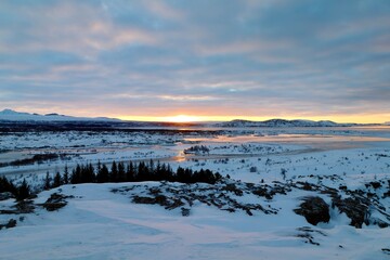 Fototapeta premium Emerging Sun Over the Tectonic Rift Valley, Thingvellir National Park, Iceland