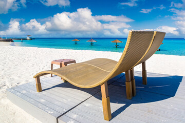 Sun bed and parasol at tropical beach