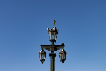 Beautiful Park Light against a Blue Sky with Monk Parakeets in Puerto Madero of Buenos Aires