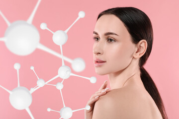 Beautiful woman with perfect healthy skin and molecular model on pink background. Innovative...