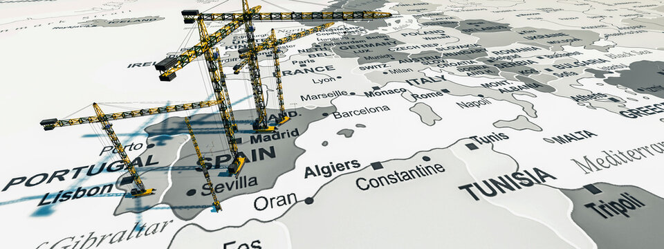 Construction Cranes Erected Over a Map of Southern Europe Symbolizing Development