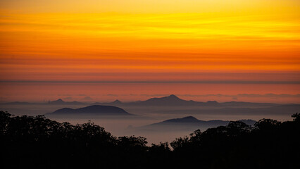 red sunset over australian mountains in main range national park seen from famous steamers trail near mount superbus; south east queensland near brisbane and gold coast