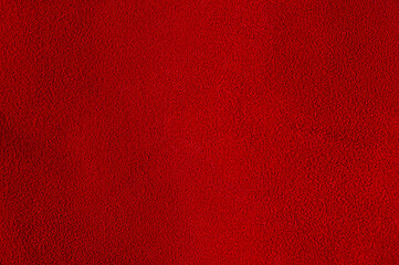 Red suede as a background material for designers. Red velvet background.