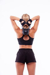 Sports girl with dumbbells in her hands on a light background - 749681023