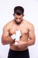 Sports guy with an elastic bandage on his arm - 749681201