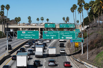 View of Los Angeles traffic and highway signs at the Hollywood 101 freeway interchange with the...