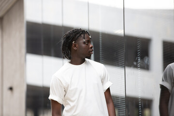 Portrait of young African American male in the city outdoor. Young black male people at outdoor....