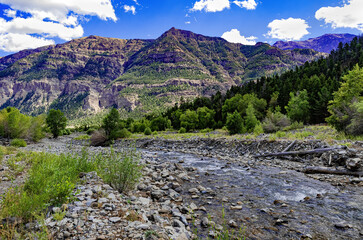 South fork Shoshone River and deep canyon summer landscape wit blue sky and clouds in northwest Wyoming, USA.