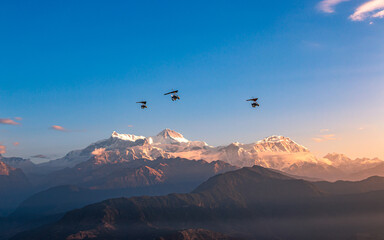 flying ultralight aircraft over the Mount Annapurna range in Nepal.
