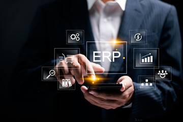 ERP, Enterprise resource planning concept. Businessman use smartphone to analyzing ERP system on...