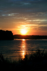 Naklejka premium sunset over water 