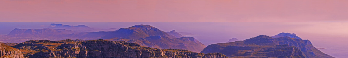 Fototapeta premium Mountains, landscape and pink sky with background for travel, hiking or eco friendly tourism and banner of Cape Town. Aerial view of sunset, nature and sea or ocean on the horizon in South Africa