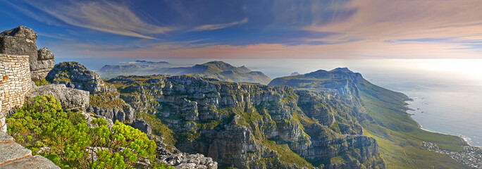 Mountains, nature and ocean with sky for travel, hiking and eco friendly tourism with banner of Cape Town. Aerial view of environment, landscape and sea on the horizon with adventure in South Africa