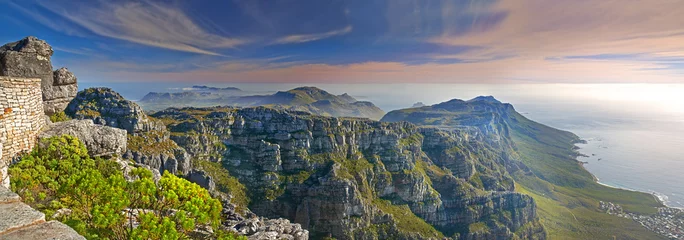 Wandcirkels aluminium Mountains, nature and ocean with sky for travel, hiking and eco friendly tourism with banner of Cape Town. Aerial view of environment, landscape and sea on the horizon with adventure in South Africa © Dhoxax/peopleimages.com