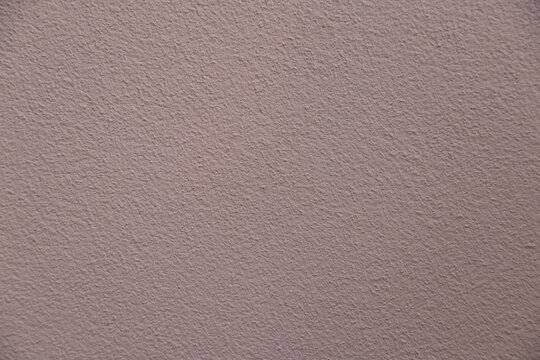 Rough leather surface with a blank white paper on top, all set against a textured leather background