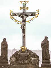 Well preserved Calvary statue on the Charles Bridge in old town of Prague the capital of the Czech...